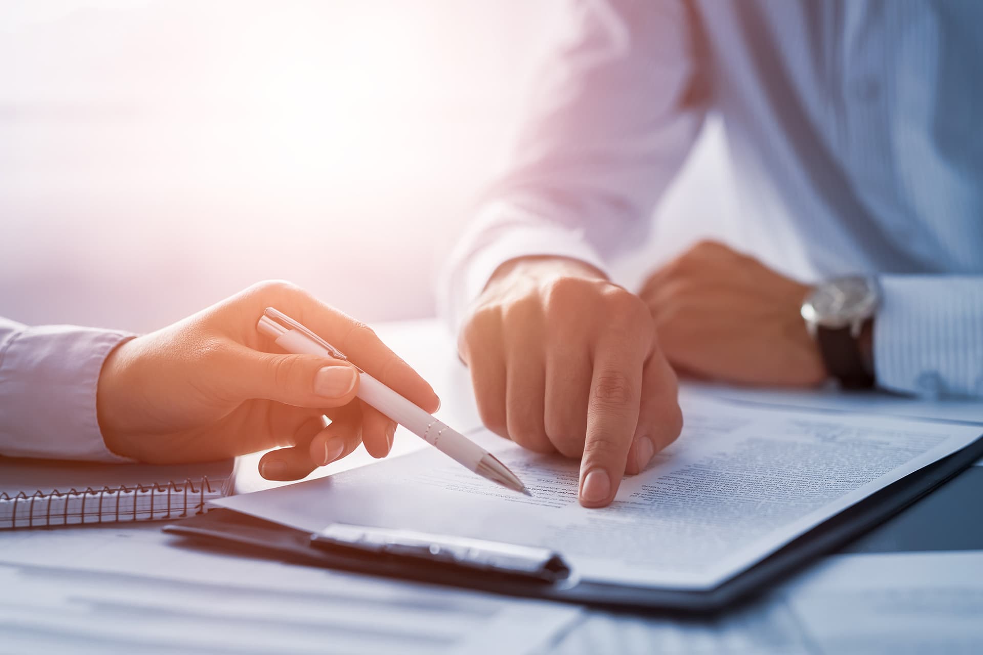 Insurance broker showing details of special limits insurance document to a client