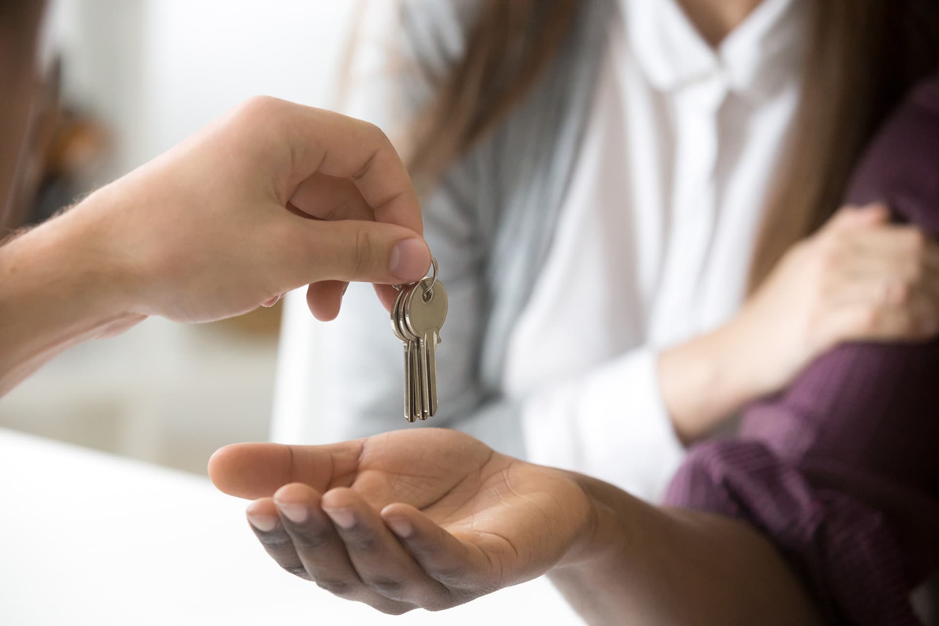 Tenant insurance for woman receiving the keys to an apartment