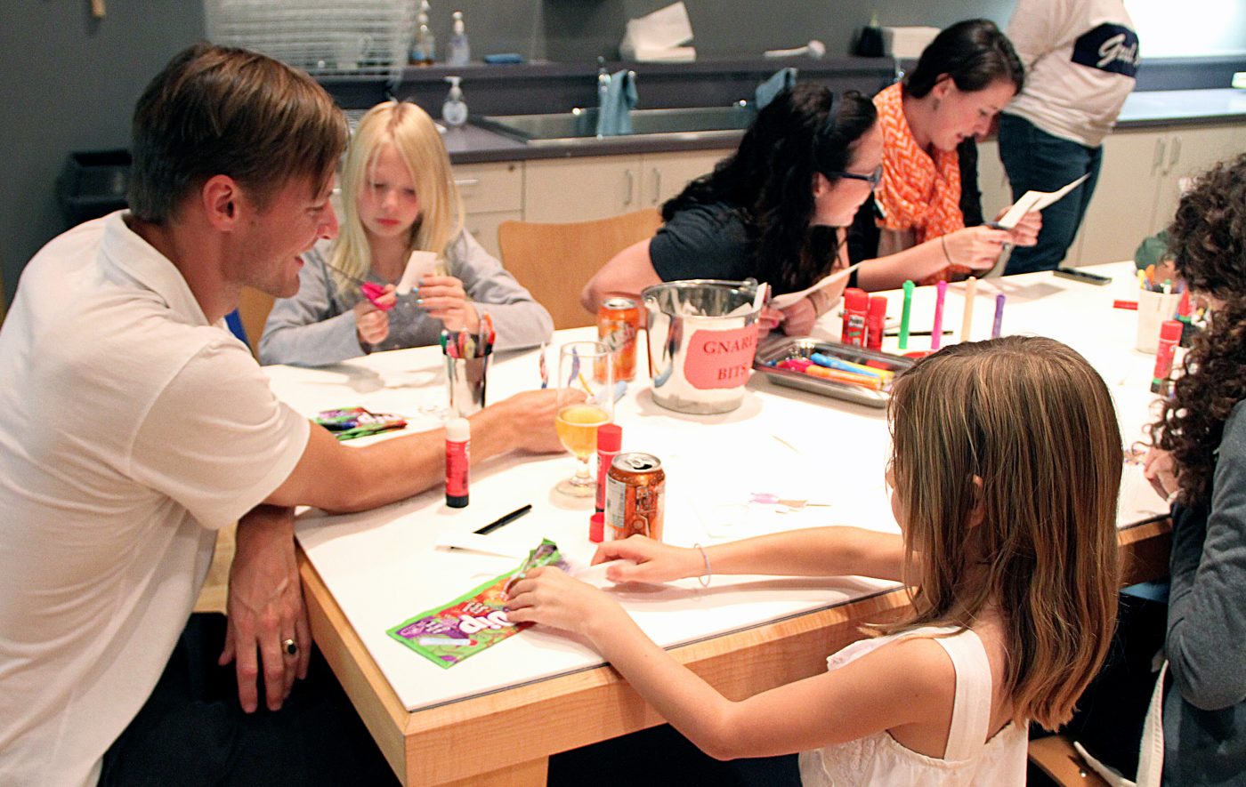 Families participate in art activities in the Discovery Room.