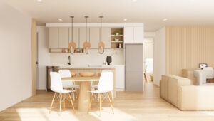 Vu sur la cuisine et une partie du salon d'un logement aux teintes sable et blanc.