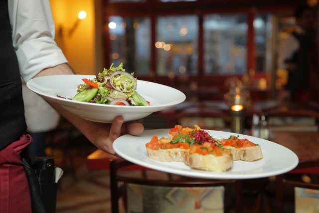 Server with 2 plates of food