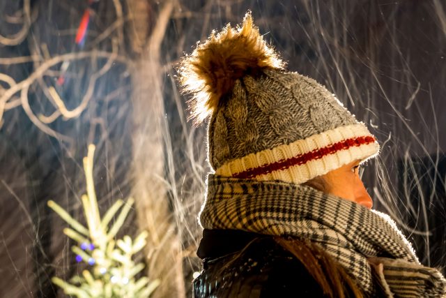 Woman's headshot wearing a toque and scarf