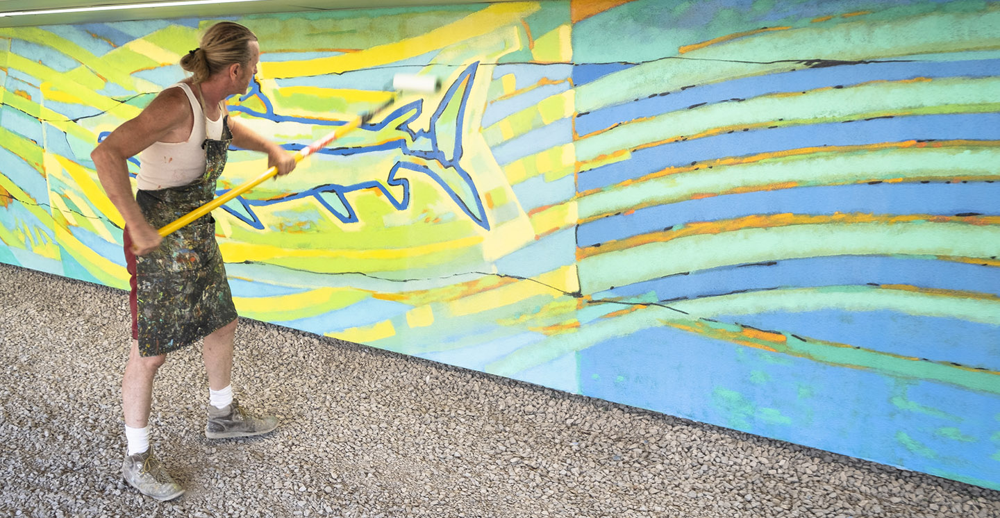 artist Bill Wrigley works on Don River mural