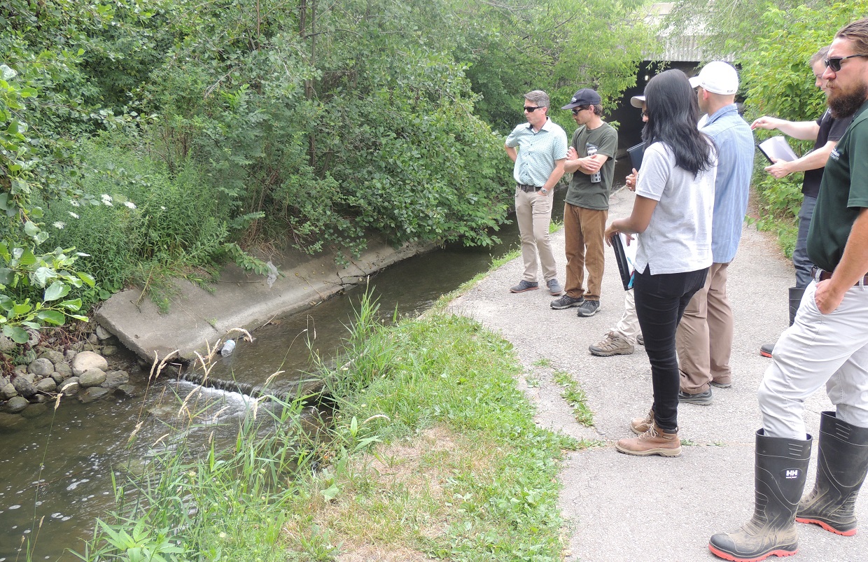 Core design and collaborative team discussing potential solutions for concrete channel within the proposed project area