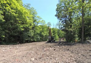 Removed soil stockpile and continued trail realignment.