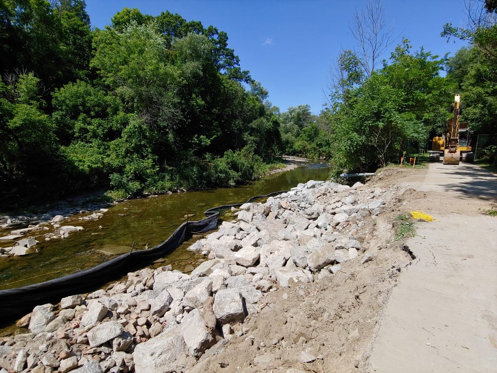 Ramp for machinery to access and complete in-water work, as well as in-water silt curtain to control sediment.