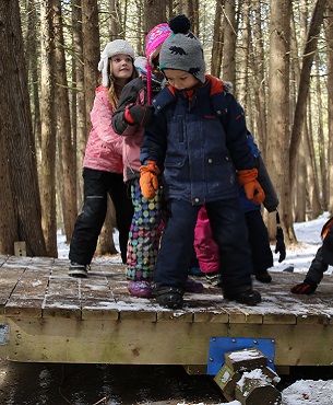 children practice balance exercise at Claremont Nature Centre winter camp