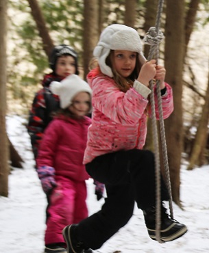 girl swings on low ropes at Claremont Nature Centre
