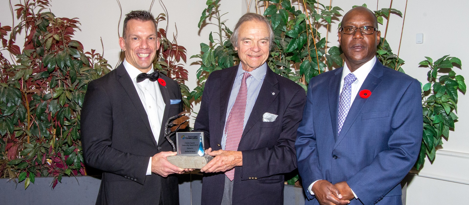 TRCA CEO John MacKenzie and Toronto and Region Conservation Foundation interim executive director Derek Edwards with Charles Sauriol award winner Michael de Pencier