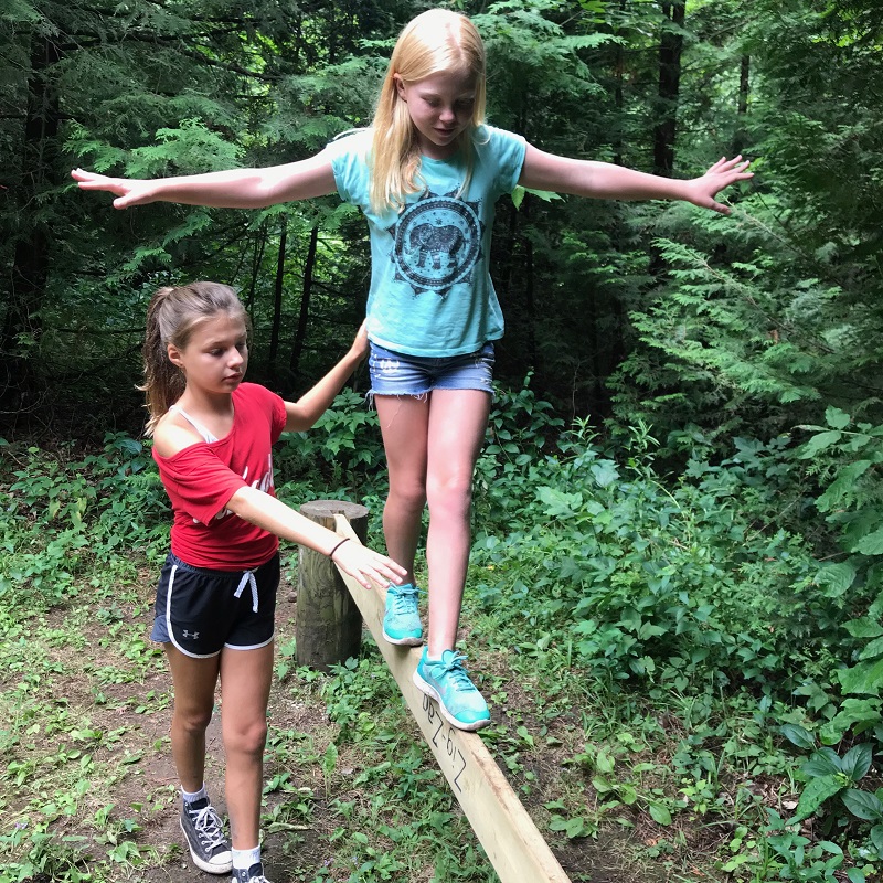 campers practice walking on balance beam at Claremont Nature Centre