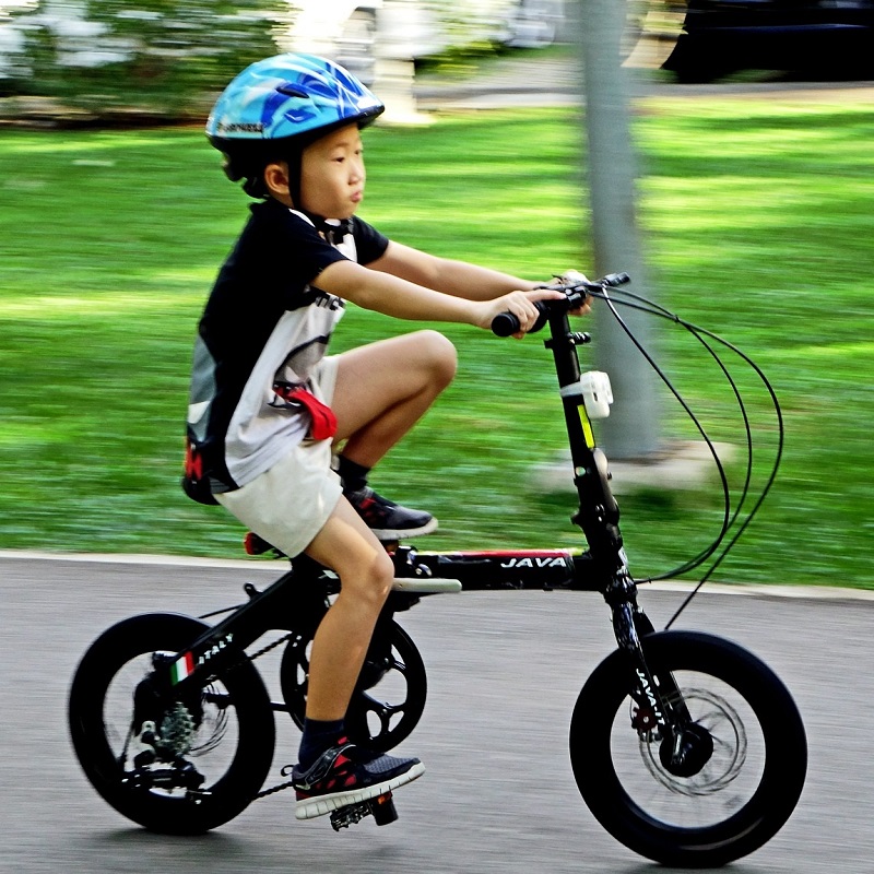 child riding bicycle