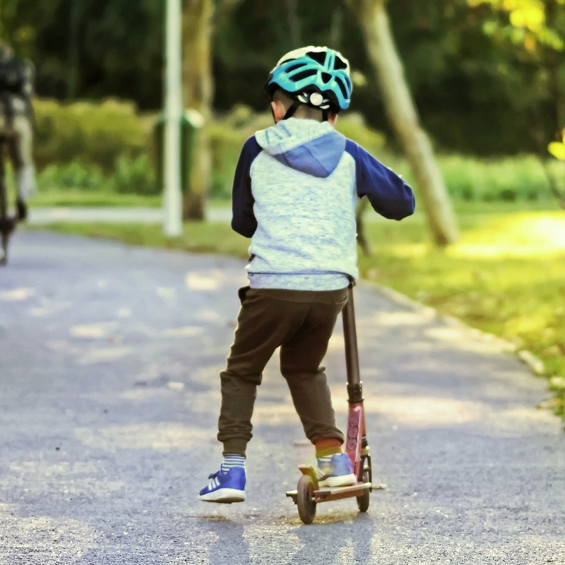 child on scooter