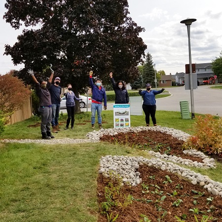 West Bolton SNAP Green Home Makeover homeowners and neighbours participate in outdoor garden implementation day