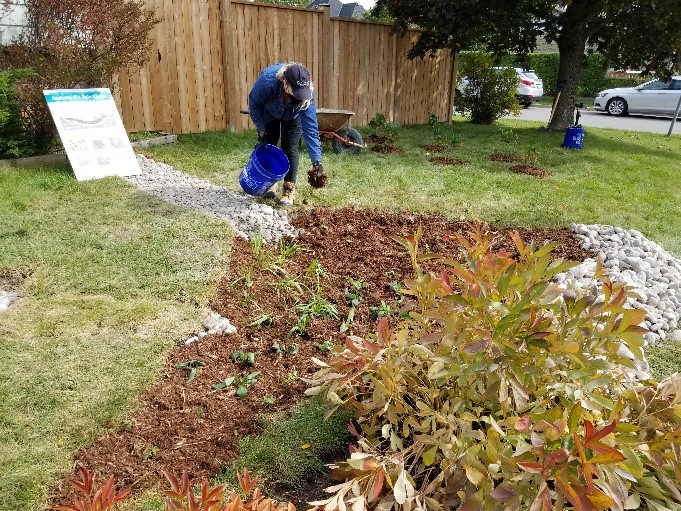 West Bolton SNAP Green Home Makeover homeowners work on outdoor retrofits