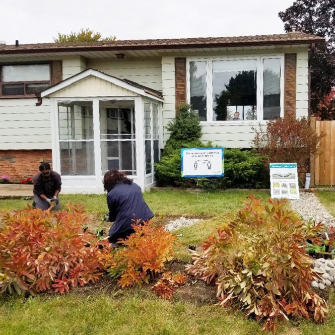 West Bolton SNAP Green Home Makeover homeowners and neighbours plant a pollinator garden