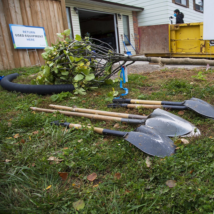 West Bolton SNAP Green Home Makeover homeowners and neighbours plant trees on their property to increase canopy