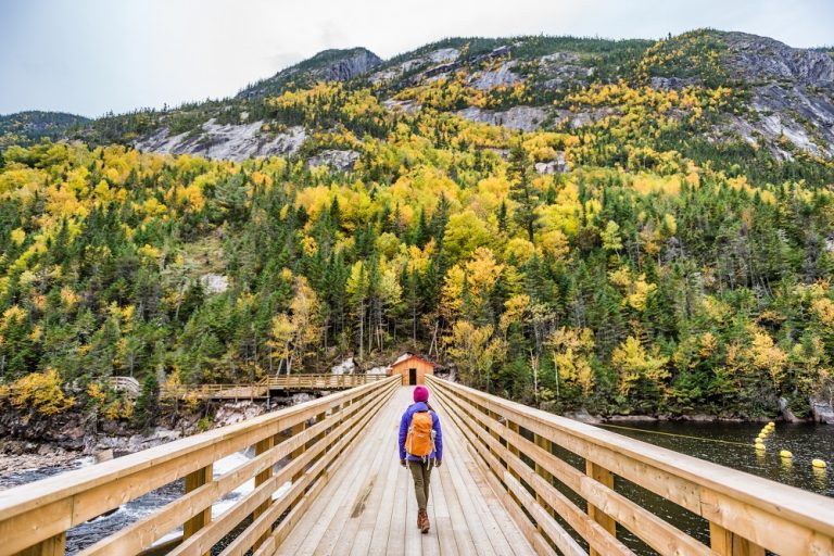 A woman hikes along a trail in Malbaie, Quebec.